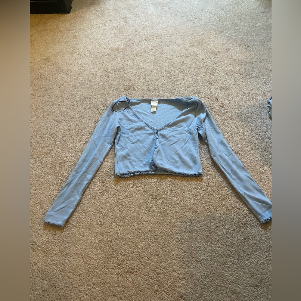 I am selling this cute baby blue blouse